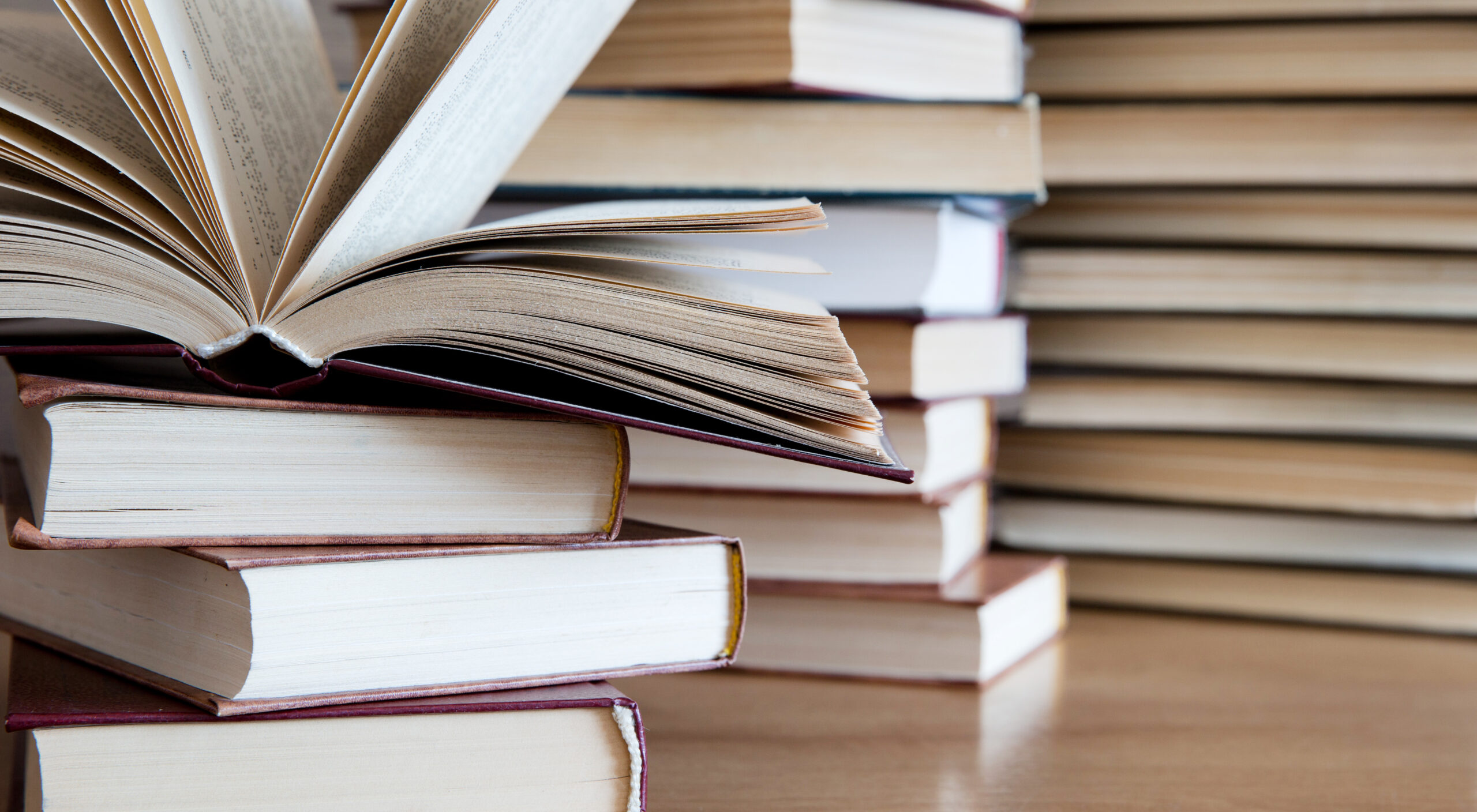 books on wooden deck tabletop